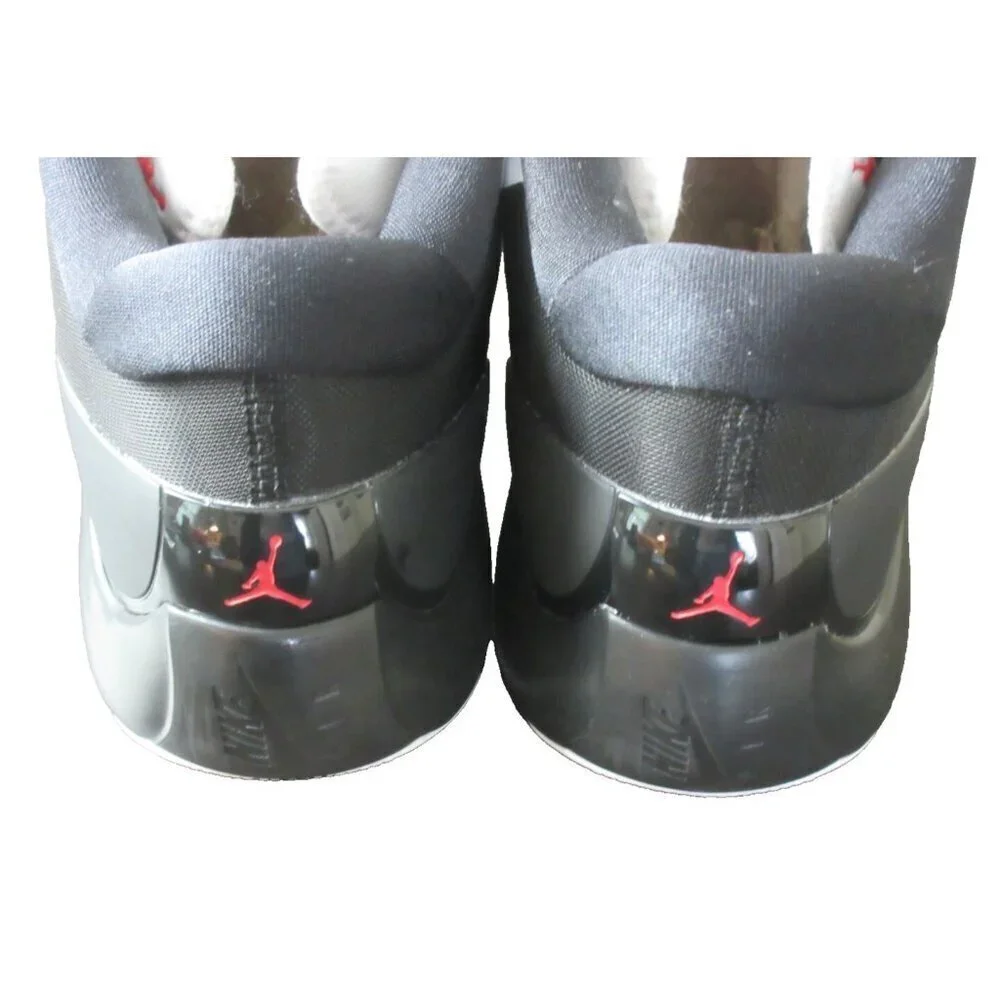 Jordan White and Black Low-Top Athletic Sneakers with Red Logo